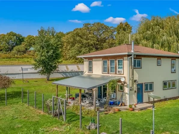 Rural property with outbuilding and open yard