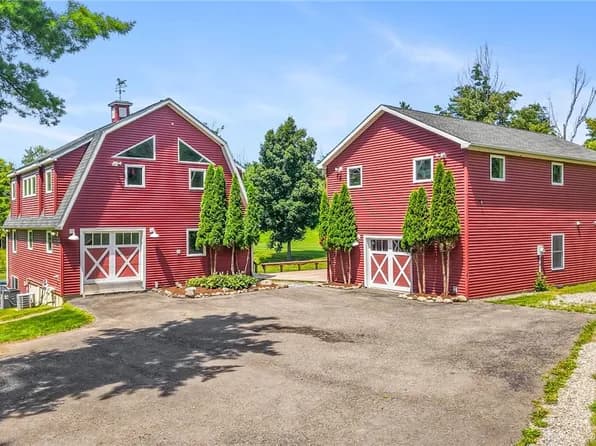 Ranch home with attached garage and paved driveway